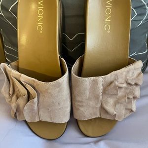 Vionic ruffle slides.